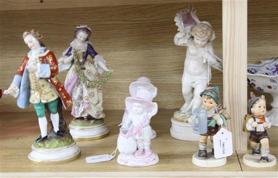 A pair of Continental porcelain costume figures, Gallant and Companion and five other figures